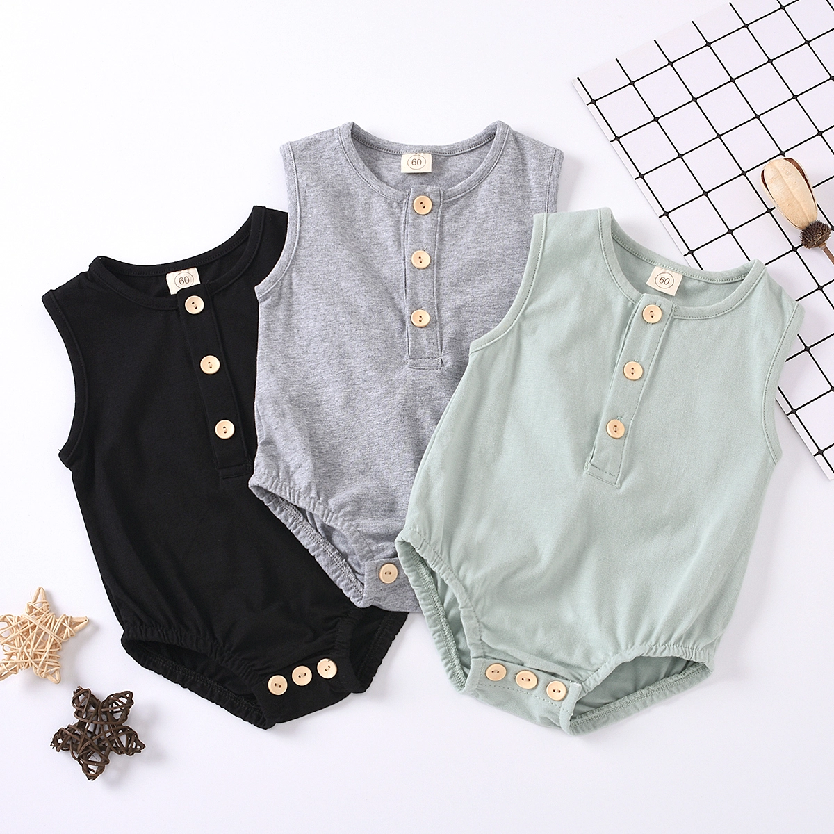 

Solid Button Design Sleeveless Baby Romper