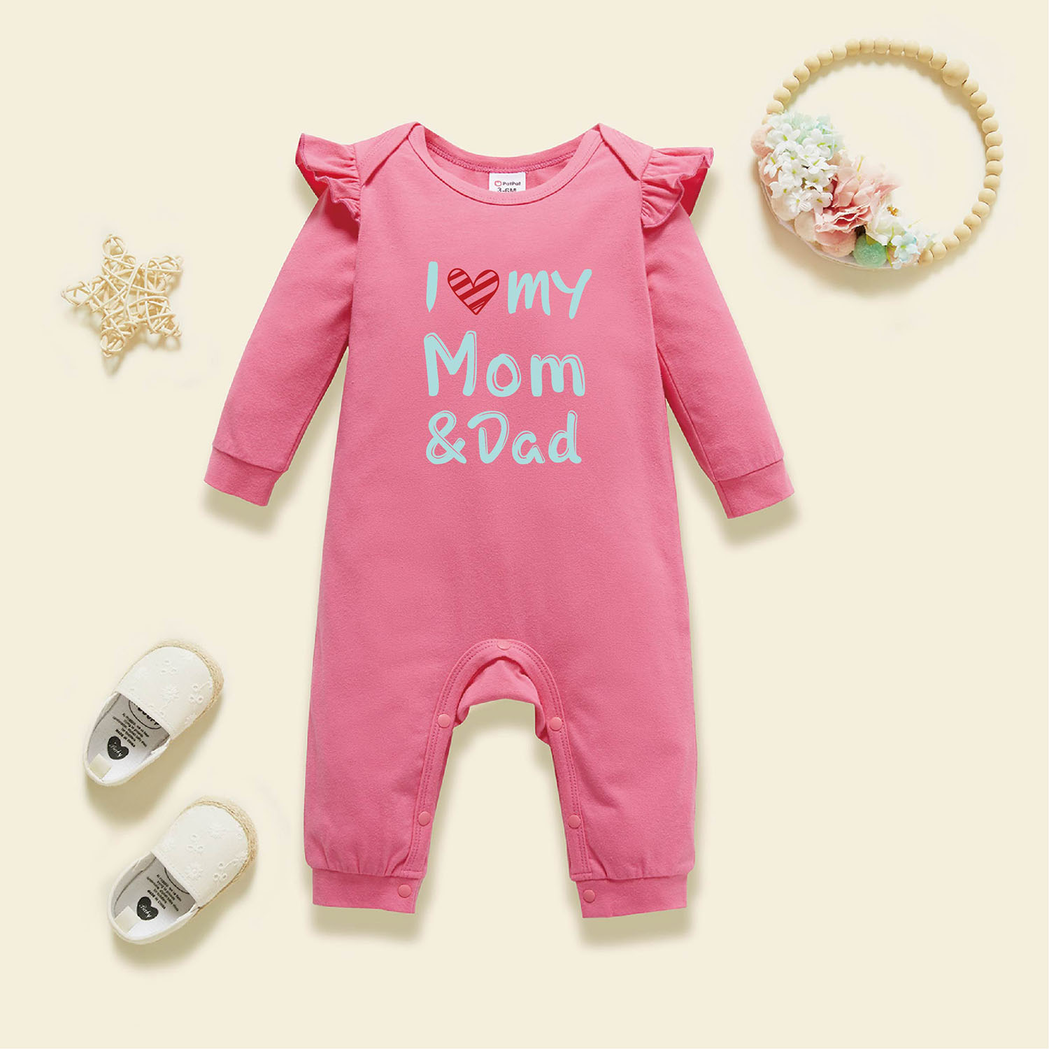 

Baby Girl Graphic Letter and Heart Print Ruffled Long-sleeve Jumpsuit