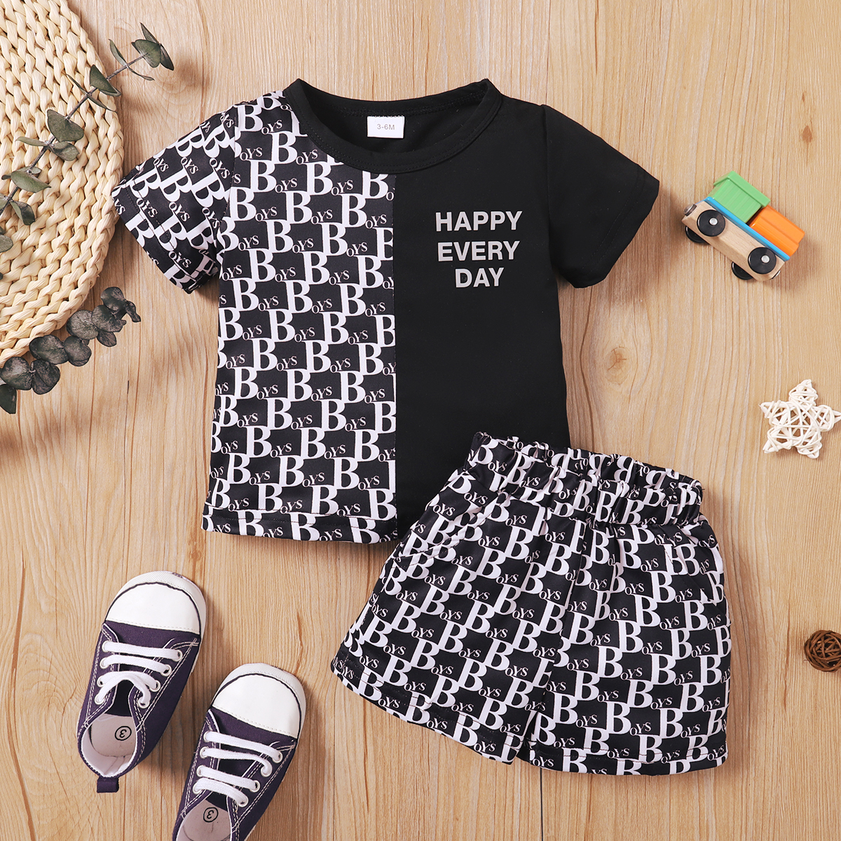 

2pcs Baby Boy Allover Letter Print Black Splice Short-sleeve T-shirt and Shorts Set