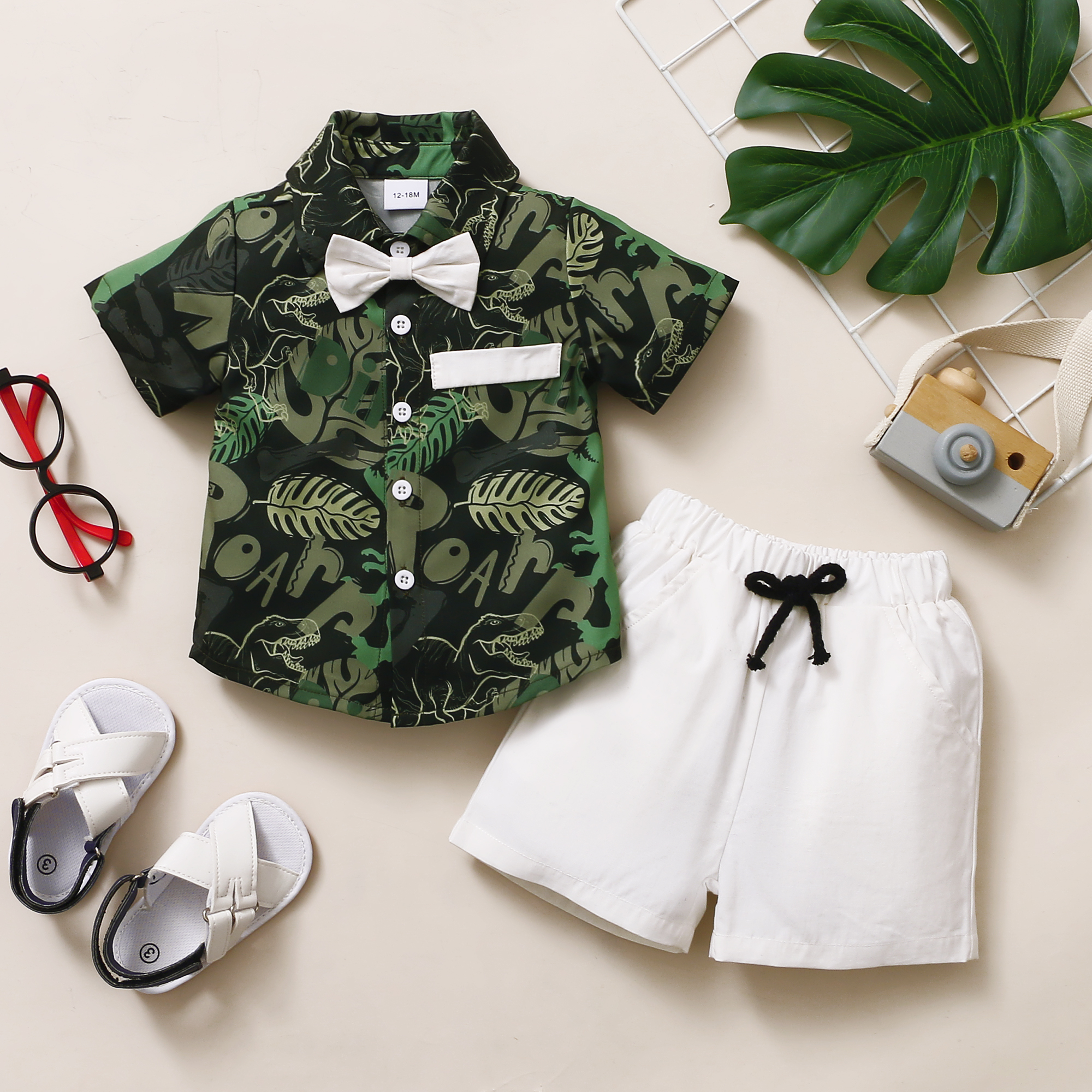 

2-piece Toddler Boy Leaf/Dinosaur Print Button Down Short-sleeve Shirt with Bow tie and Solid 100% Cotton Shorts with Pocket Set