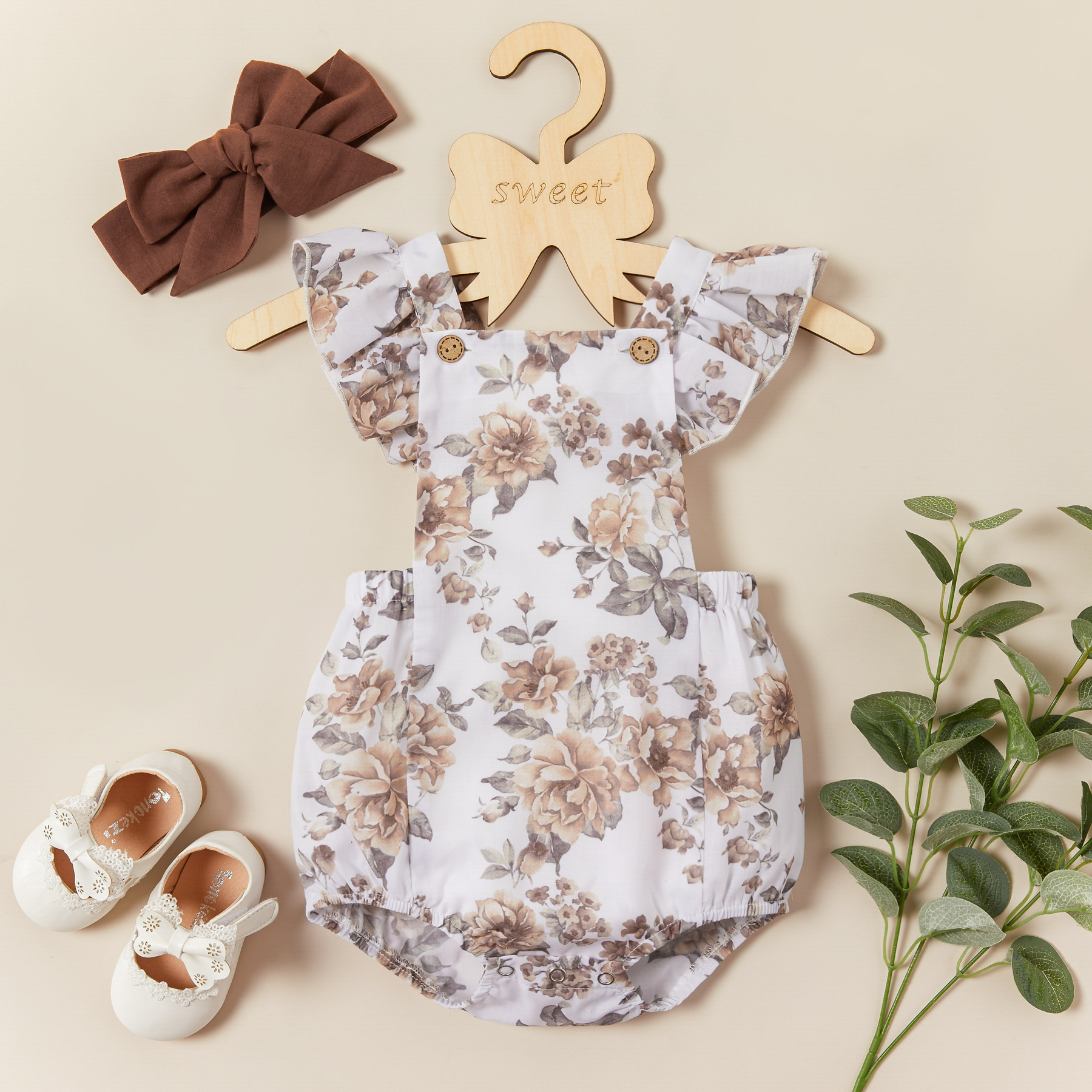 

2-piece Baby Floral Allover Flutter-sleeve Romper with Headband Set