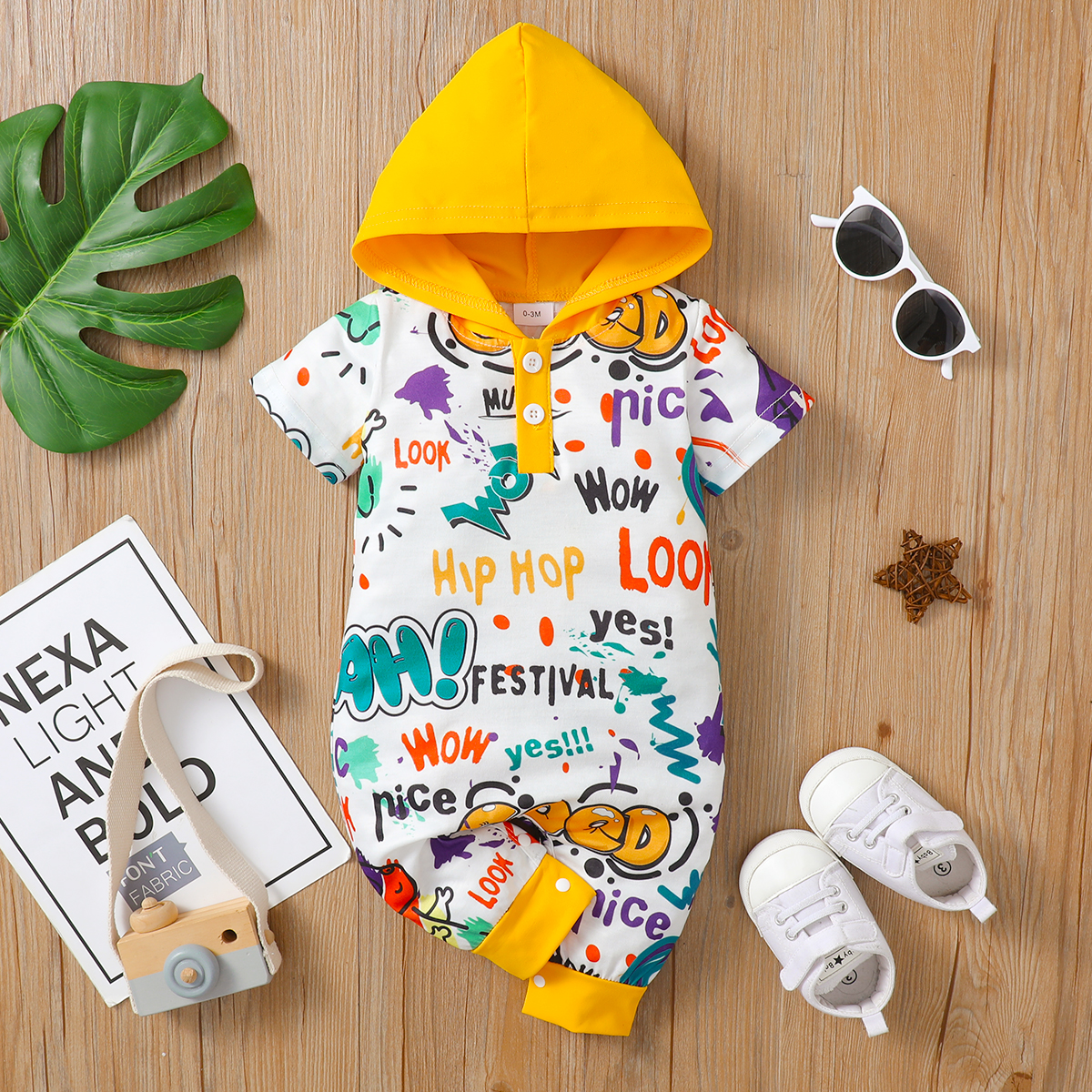 

Baby Boy All Over Cartoon Dinosaur and Letter Print Short-sleeve Hooded Jumpsuit