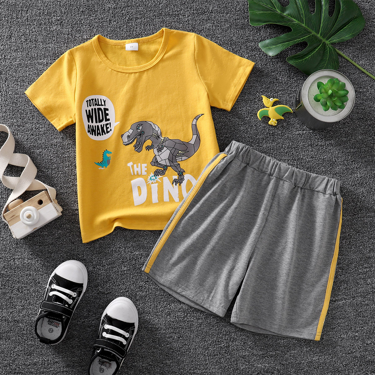 

2pcs Toddler Boy Casual Letter Dinosaur Print Tee and Striped Shorts Set