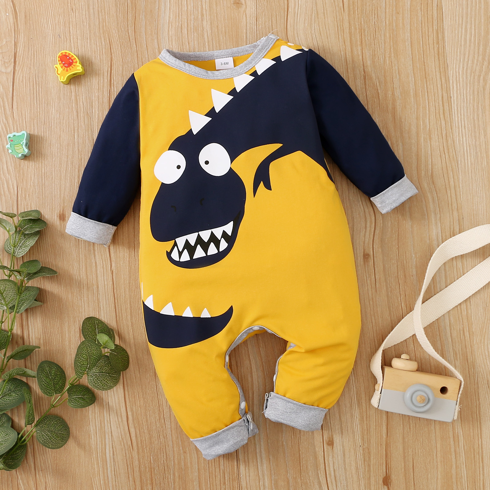 

Baby Boy Cartoon Dinosaur Print Long-sleeve Colorblock Jumpsuit