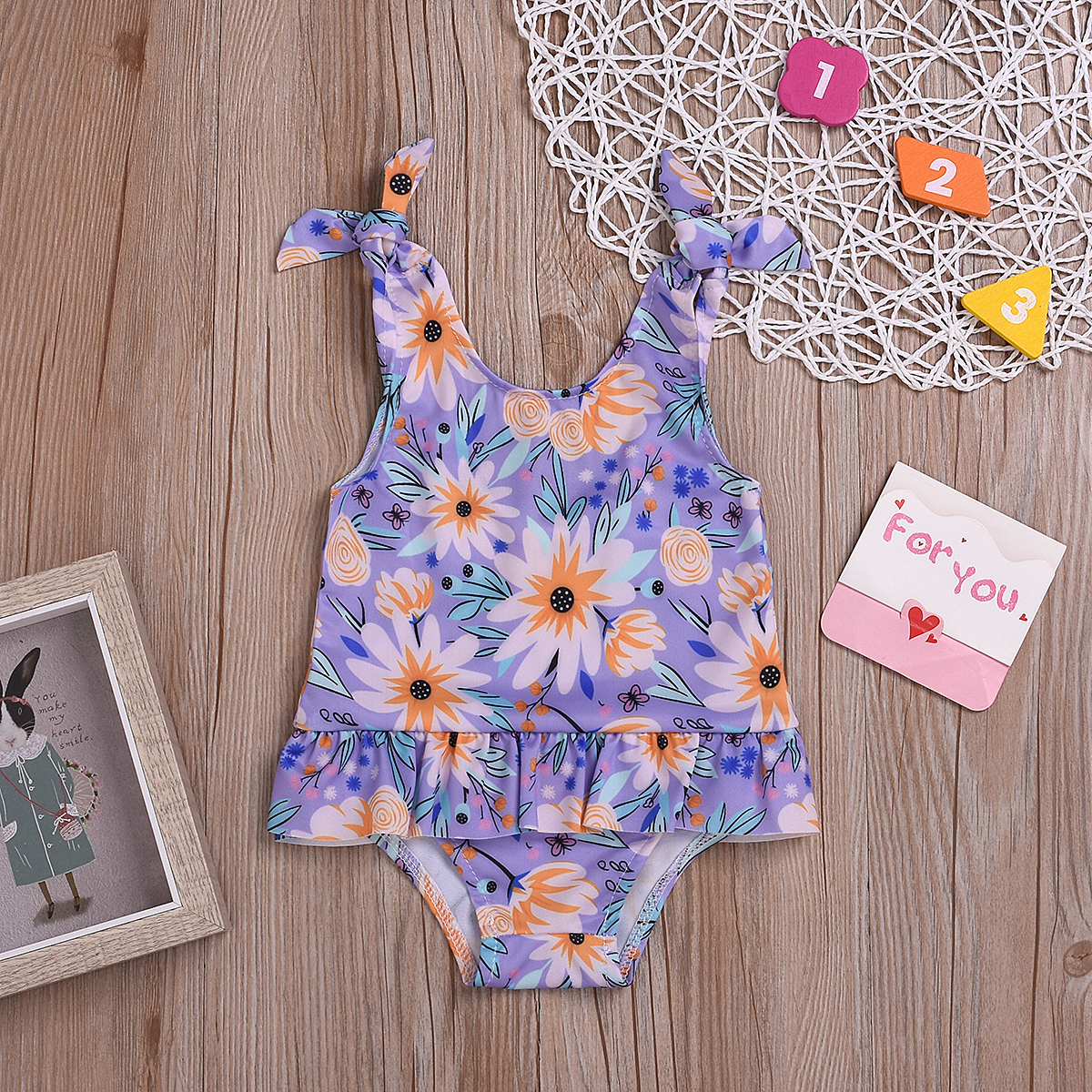 

Baby Strappy Daisy Design Bodysuit