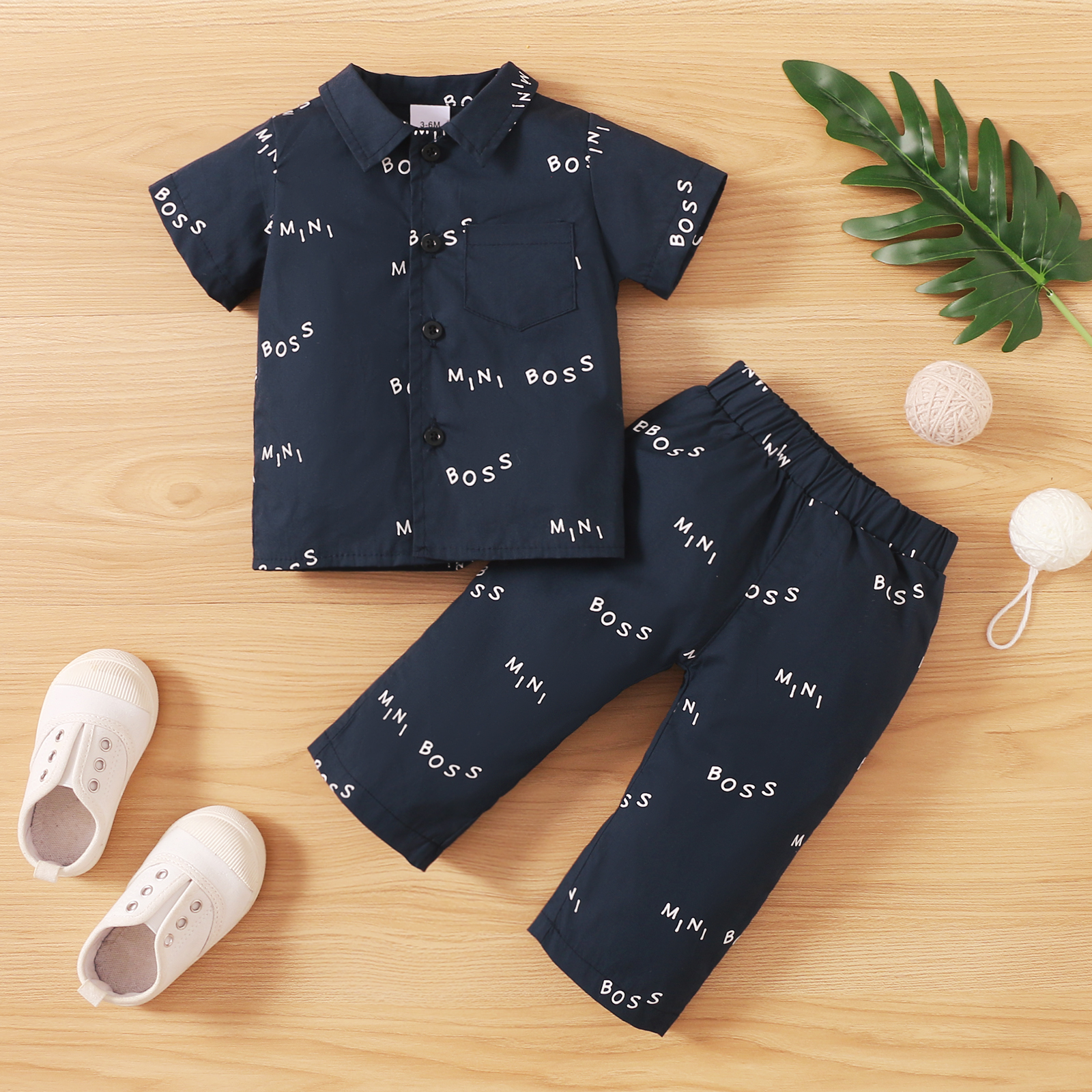 

Baby 2pcs All Over Letter Print Navy Blue Short-sleeve Shirt Set