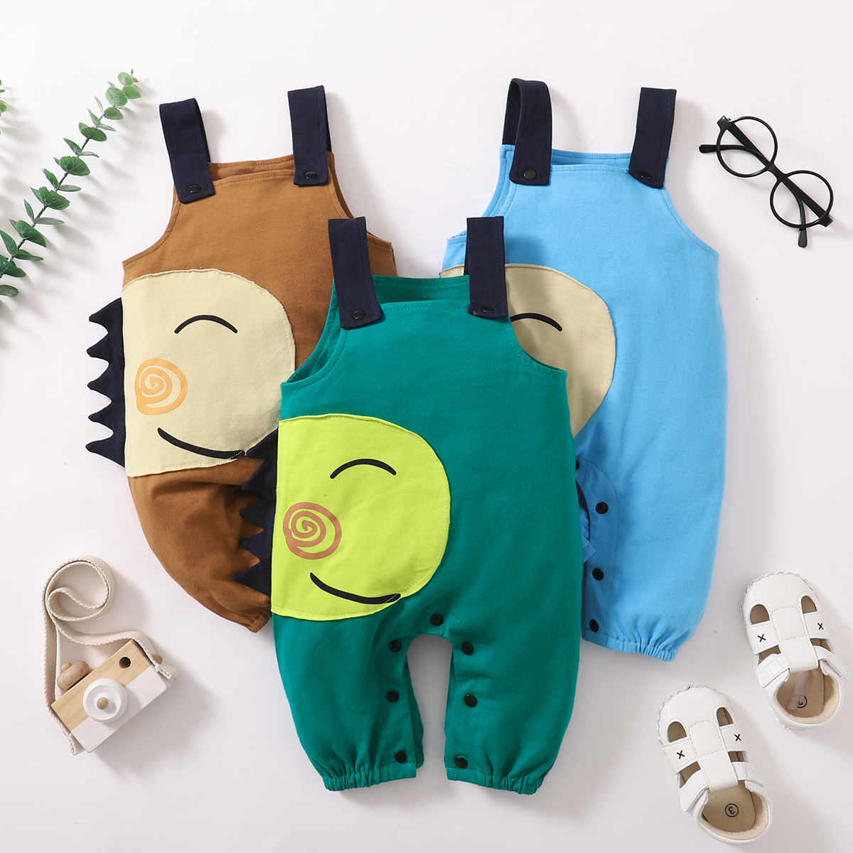 

Solid Color Dino Face Patch Baby Overalls Jumpsuit
