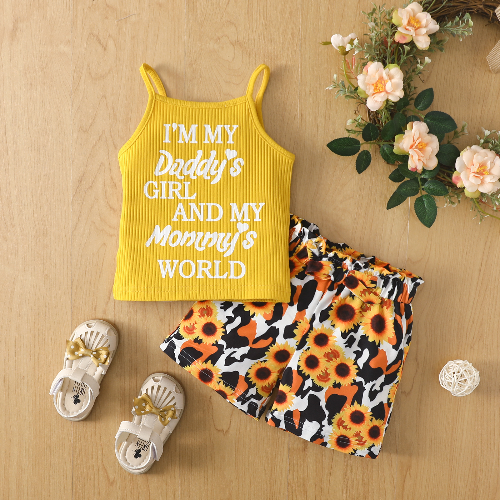 

2pcs Toddler Girl Letter Print Ribbed Yellow Camisole and Bowknot Design Floral Print Shorts Set
