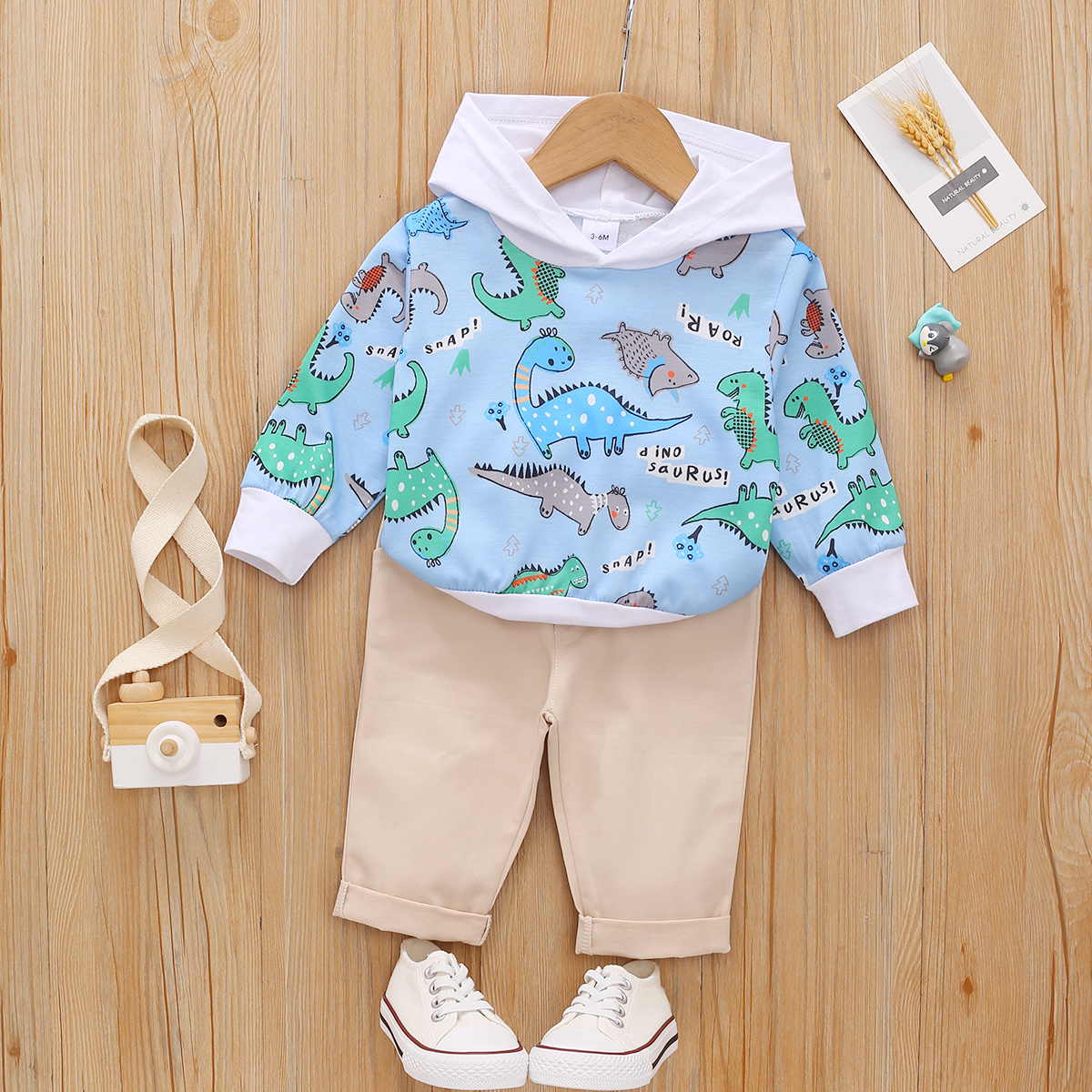 

2pcs Baby All Over Cartoon Dinosaur and Letter Print Long-sleeve Hoodie with Solid Trousers Set