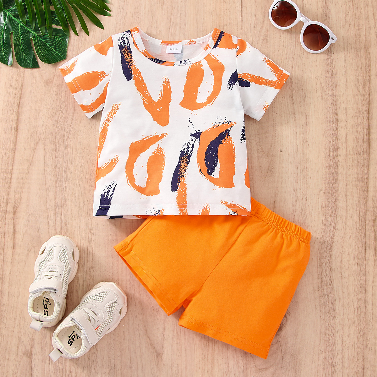 

2pcs Baby Boy 95% Cotton Shorts and All Over Graffiti Print Short-sleeve Tee Set