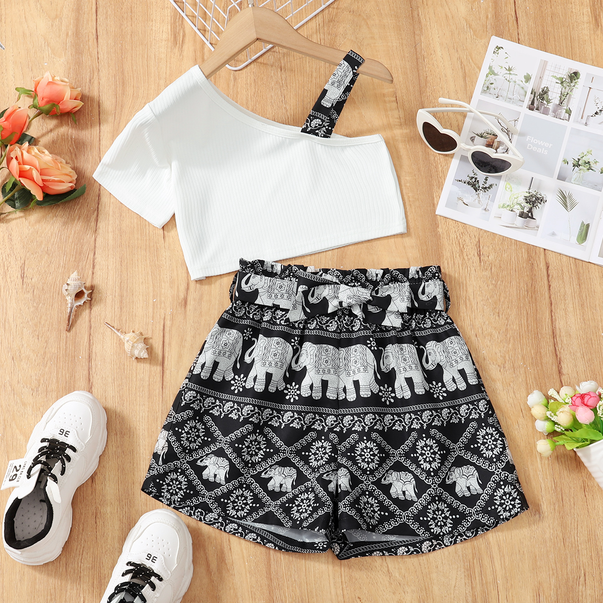 

2-piece Kid Girl One Shoulder Ribbed Strap Tee and Elephant Print Exotic Print Shorts Set