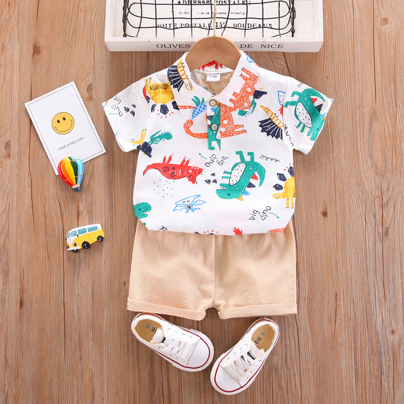 

2pcs Baby Boy All Over Cartoon Dinosaur Print Short-sleeve Shirt and Solid Shorts Set