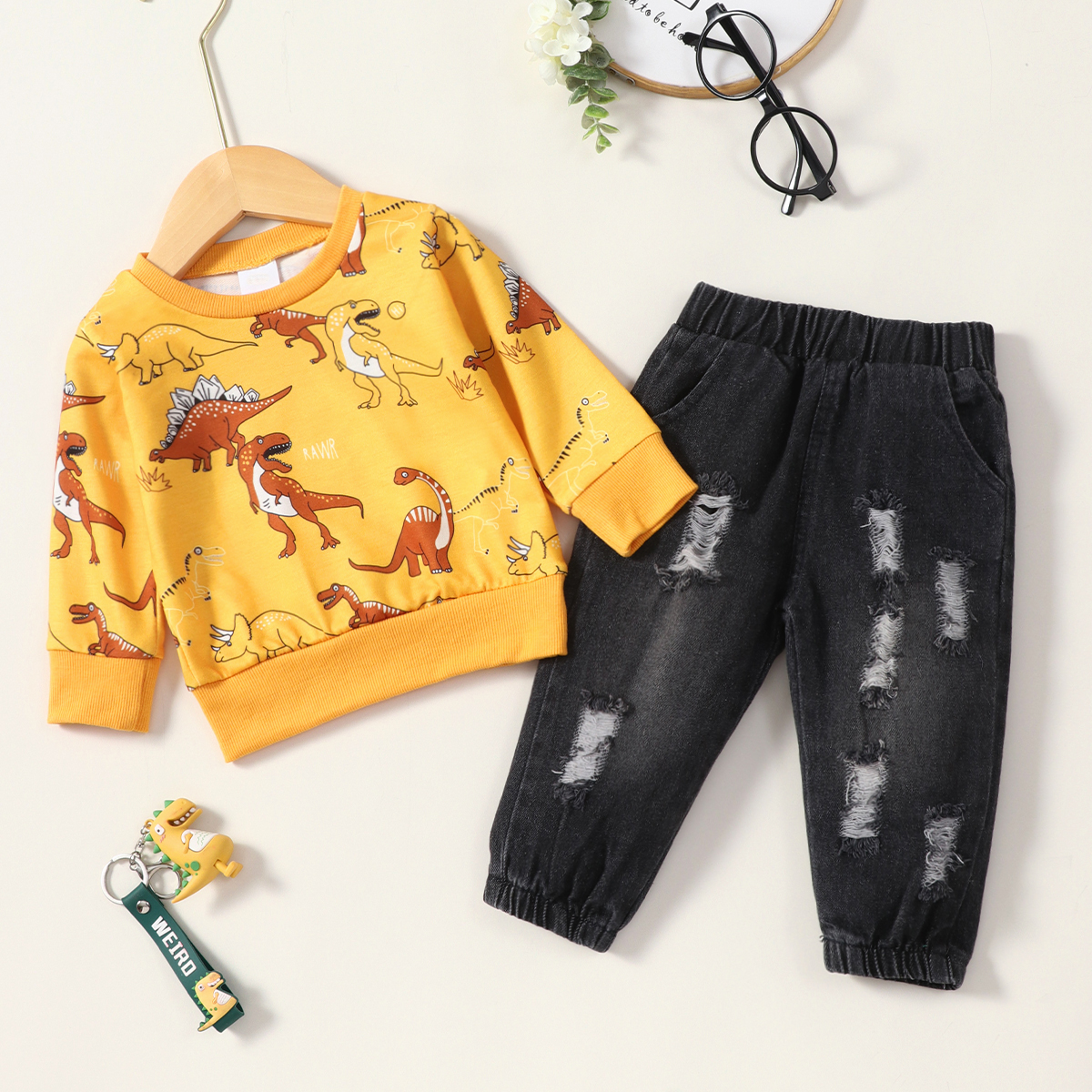 

2pcs Baby Boy Cartoon Dinosaur Print Long-sleeve Sweatshirt and Denim Ripped Jeans Set
